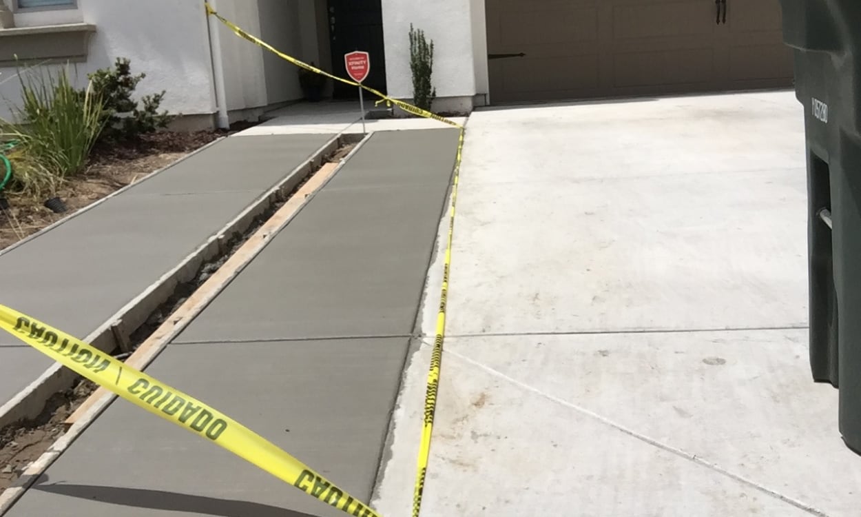 Enhancing curb appeal with a fresh driveway and walkway